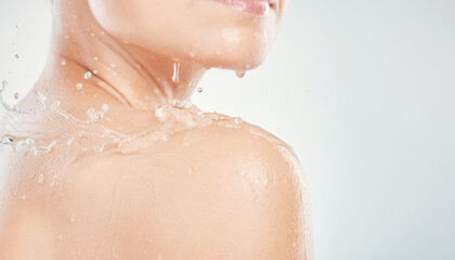 Fototapeta premium Serene close up of fresh cool water splashing on bare clean skin. tangible texture of each wet droplet shows refreshing moment of body care and personal hygiene