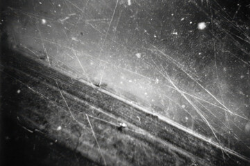 damaged film strip macro closeup reveals burnt scratches peeled emulsion and vintage decay on celluloid