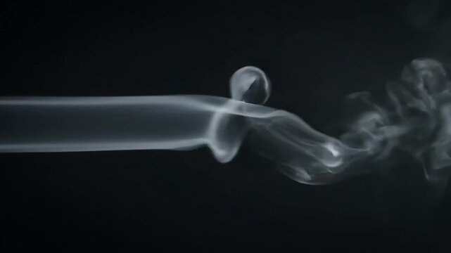 A gray smoke swirling in the darkness