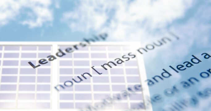 Displaying word Leadership running diagonally across frame at outdoor facade with grid panels