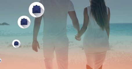 Naklejka premium Walking couple holding hands, strolling on sandy beach with white clothing and blue envelope badges