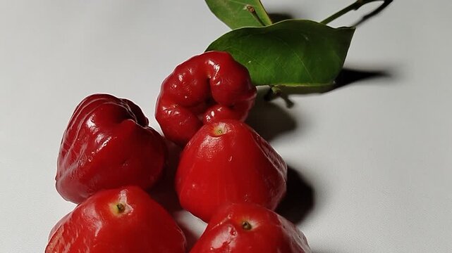 Close up of fresh water rose apples (Syzygium aqueum), a juicy tropical fruit commonly found in local markets.