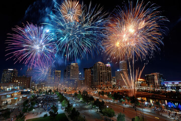 Naklejka premium Fireworks over a cityscape at night