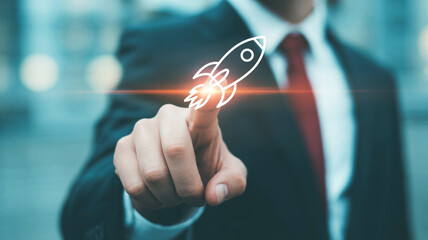 Business professional activates a glowing rocket ship icon with their finger