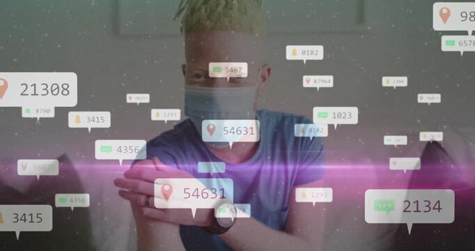 Man raising hand rolling up sleeve, health chat bubbles counters map pins appearing around him