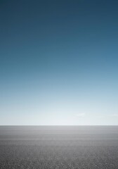 Fototapeta premium Expansive empty sky meeting a flat, featureless plane below the sharp horizon line, symbolizing solitude, potential, and limitless space, design, simplicity, simple