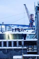 Fototapeta premium view of crane in blue winter dusk in Murmansk