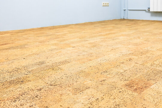freshly laid brown cork tile flooring in room
