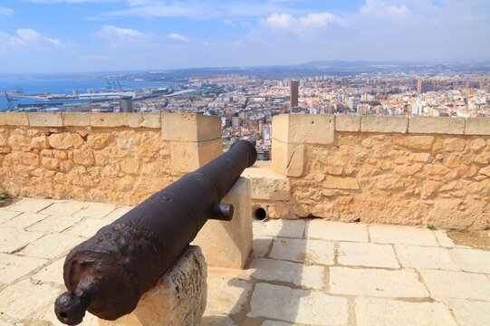 Alicante city view with cannon from Castle of Santa Barbara. Alicante in Valencian Community (Comunidad Valenciana), Spain.