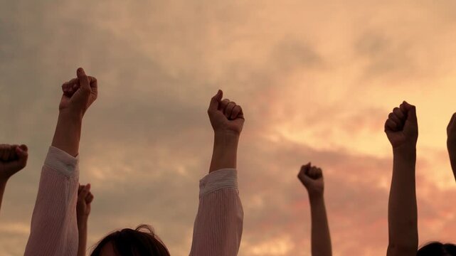 Group people raise hands to sky. Business people, Teamwork. Concept voluntary voting, expressing consent, supporting freedom. Concept people's rights freedoms to choose from. Raise fist make choice.