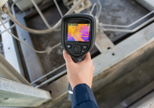 Thermal inspection with an infrared camera captures temperature patterns on industrial equipment, supporting preventive maintenance, fault detection, safety checks, and reliability.