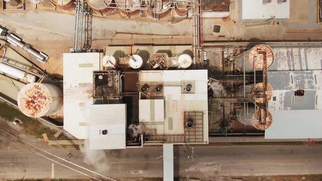 Top-Down Aerial View of Industrial Factory Infrastructure, Storage Silos, and Chemical Plant