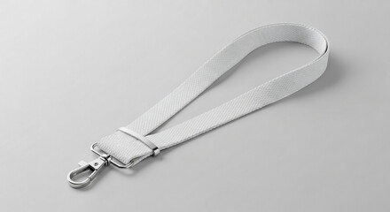 Simple white fabric lanyard with a silver metal swivel clasp on a neutral grey surface.