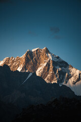 Obraz premium Trango towers mountain peak glowing at sunset in karakoram pakistan. Paiju koburtse