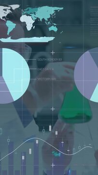 Two male researchers bringing green flask closer in lab, initiating AR charts analyzing sample