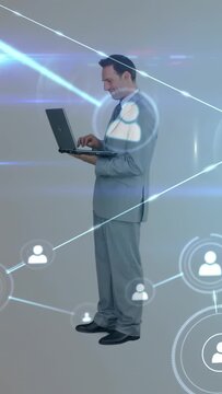 Appearing network UI guiding suited team, sealing deal with handshake in studio, laptop red folder