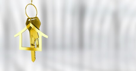 Hanging metallic gold house keychain holding two brass keys on pale gray backdrop, copy space