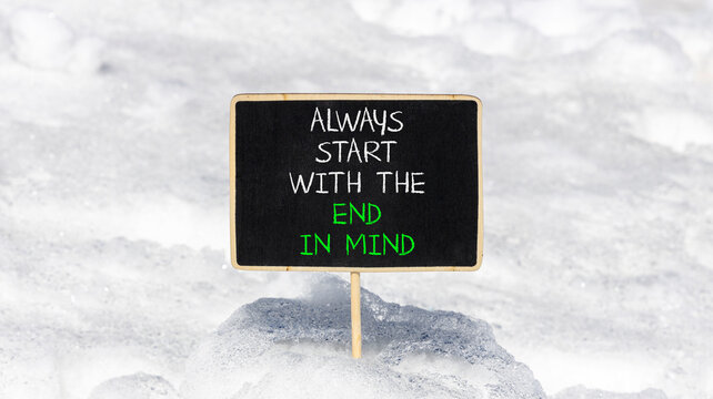 Start with the end in mind symbol. Concept words Always start with the end in mind on beautiful black blackboard. Beautiful snow background. Business start with the end in mind concept. Copy space.