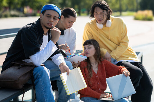 Young friends create memories while sharing ideas in a sunny park setting
