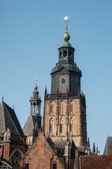 Fototapeta premium Drogenapstoren church tower rising above zutphen rooftops