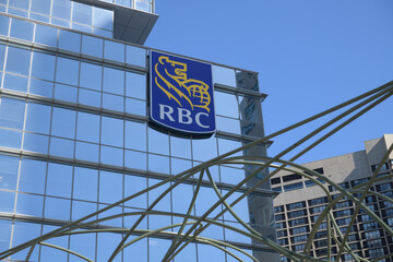Obraz premium RBC corporate logo on the exterior of RBC WaterPark Place, a business centre, located at 88 Queens Quay W, Toronto
