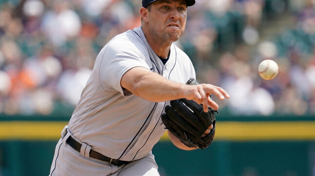 Baseball pitcher throwing ball during professional game