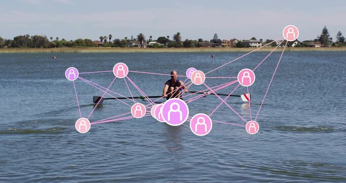 Senior rower starting with oar pull, rowing on lake, pink network shifting around boat for sports