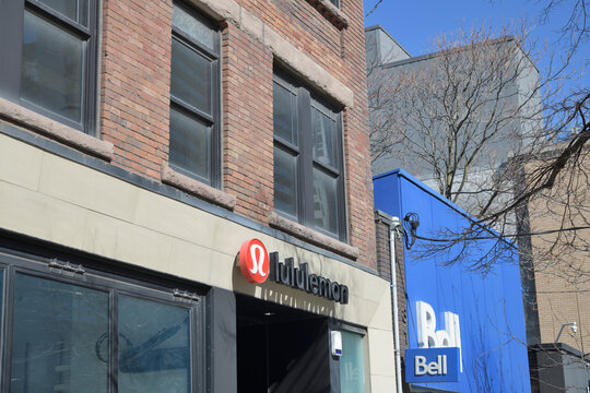 exterior building facade and sign of lululemon (318 Queen W) and Bell (316 Queen St W), Toronto