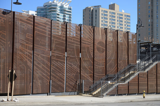 wide view of "High light" at the northeast corner of Rees St and Lake Shore Blvd W, a laser-cut stainless steel barrier designed by Nicholas Bevanda (of CEI Architecture) and The Planning Partnership