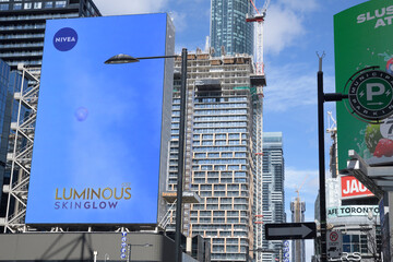 Naklejka premium digital advertising billboards facing Sankofa Square / looking north on Yonge St from Dundas St E, Toronto