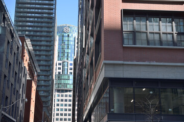 Naklejka premium looking east on Mercer St to Metro Hall and rooftop logo from Blue Jays Way, Toronto