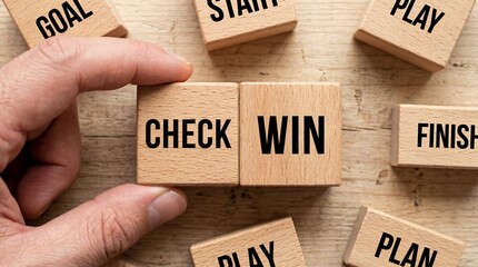 Hand placing wooden blocks with check win.