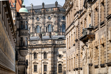 Fototapeta premium Baroque architecture with sculptures and detailed facades near the Hofkirche in Dresden. Ideal for architecture and culture themes.