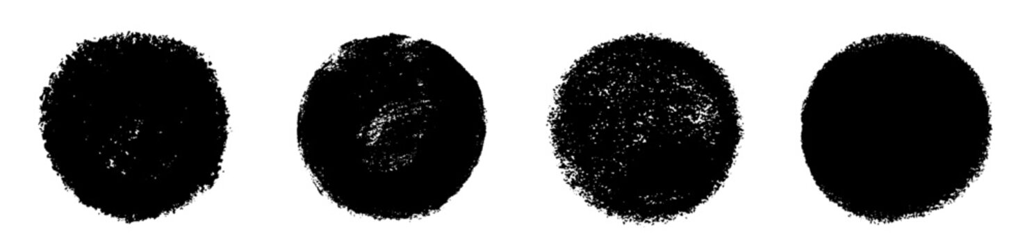 Set of black grunge circle stamps isolated on white background. Rough round ink marks with distressed edges, textured brush effect, speckled surfaces and varied opacity in four different styles.