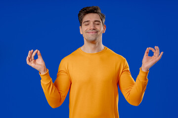 Calm Mature Handsome Man Relaxing, Meditating. Guy Calms, Breathes With Mudra Om