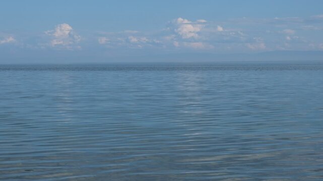 Calm sea, tranquil ethereal view. Harmony, relax, meditating, mental health concept. Dreamy scenery. Pure water and vast, cloudy horizon, capturing the essence of harmony, solitude and quiet reflectio