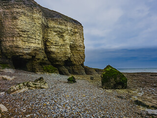 Rocky beach and coastal cliffs at Sainte-Honorine-des-Pertes Normandy France