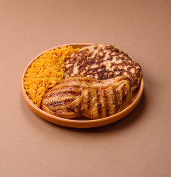 Dajaj Mashwi, an Arabic dish with rice and chicken, salt, and spices. Dajaj Mashwi as a background