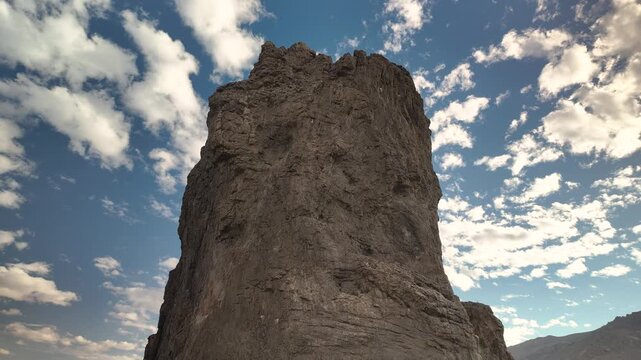Motionlapse of the massive volcanic rock formation known as Piedra Parada with clouds moving in the background in Patagonia, Argentina