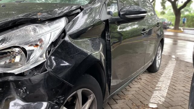 Car accident. A collision scar on the front of a car. A close-up of the deformation of the body after the accident.