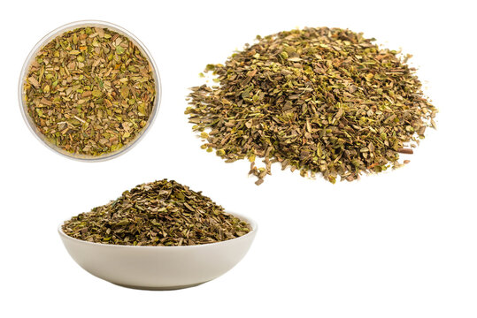Oregano in a bowl isolated on white background.