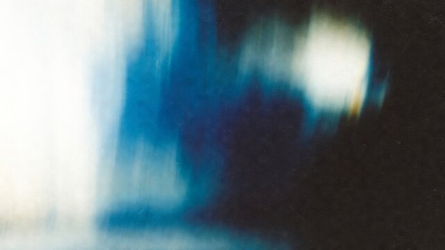 Abstract blue and white gradient background with fluid motion blur, creating a contemporary and artistic texture