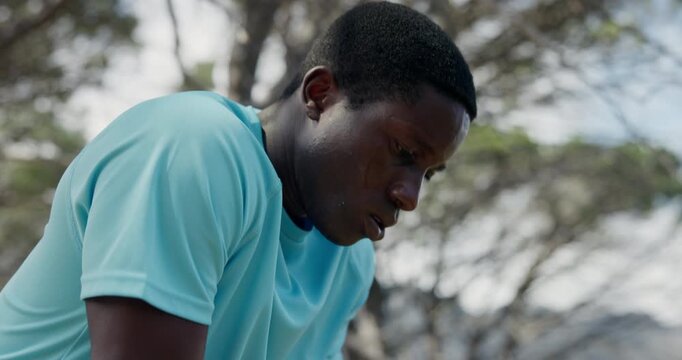 Breathe, tired or black man in forest, fitness for health benefits or challenge for trekking. Nature, person and runner in woods, dehydration or rest for training, endurance or exhausted with burnout