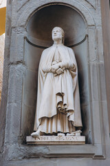 Fototapeta premium Andrea Orcagna statue in Uffizi Gallery niche, Florence, Italy, representing Renaissance art and history