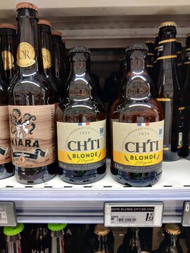 Saujon, France - October 25, 2025: Super U. CHTI Blonde beer bottles displayed on a supermarket shelf, showcasing unique branding and design elements for editorial use