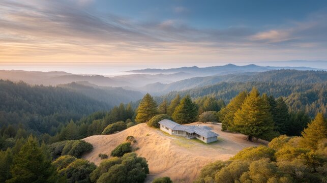 Serene Mountain View with Cabin in Lush Green Valley Surrounded by Majestic Hilltops at Golden Hour