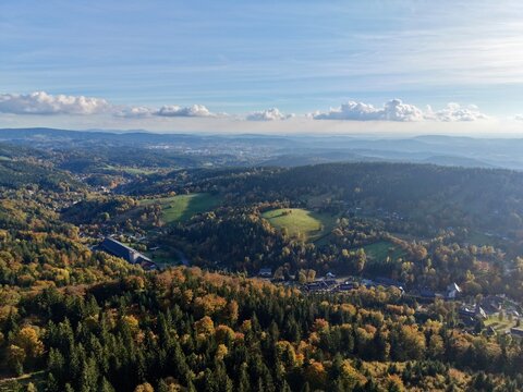 open land featuring hills and flowing streams, scenic view of farmland with rivers and rolling hills