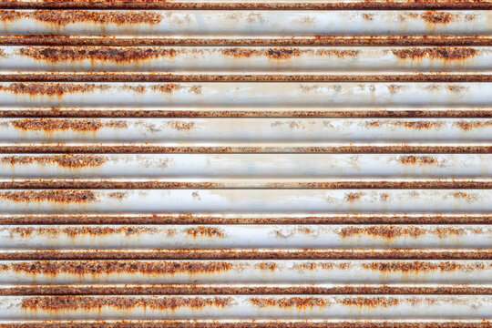 Close-up of a rusty and corroded metal shutter