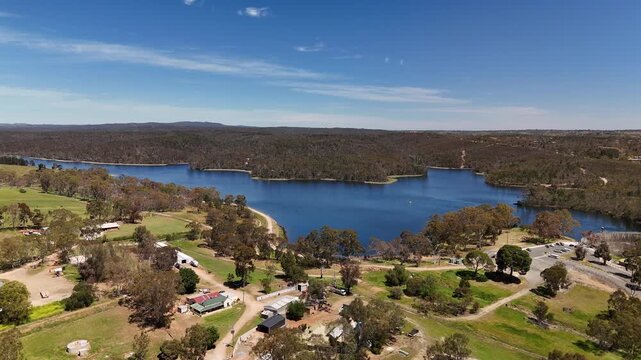 Barossa Reservoir Reserve, Williamstown, South Australia &ndash; 4K aerial drone footage of Whispering Wall dam, blue reservoir lake and surrounding forest landscape