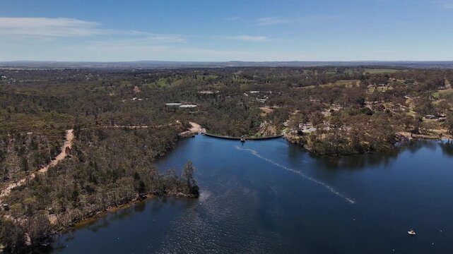 Barossa Reservoir Reserve, Williamstown, South Australia &ndash; 4K aerial drone footage of Whispering Wall dam, blue reservoir lake and surrounding forest landscape